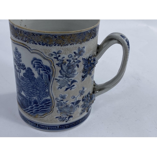 611A - A late 18th early 19th century Chinese blue and white large mug/tankard for the export market with r... 