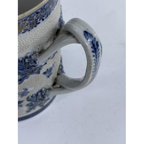 611A - A late 18th early 19th century Chinese blue and white large mug/tankard for the export market with r... 