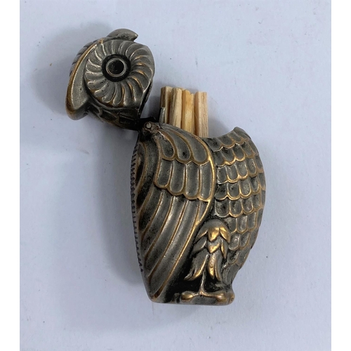 187 - A 19th century silver on brass owl vesta case