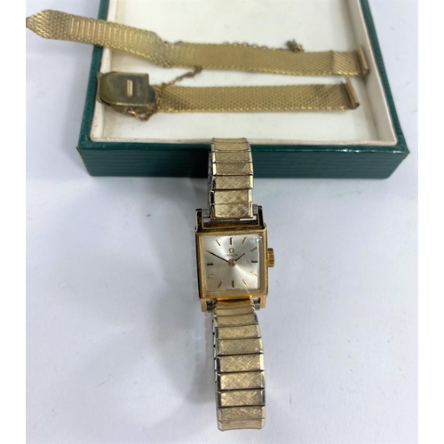 615 - A vintage ladies Omega wristwatch with square dial on later expanding strap.