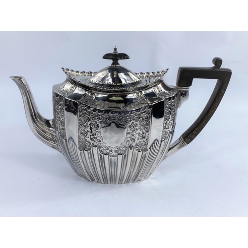 623A - An oval victorian hallmarked silver teapot with extensive embossed gadrooned decoration, Sheffield (... 