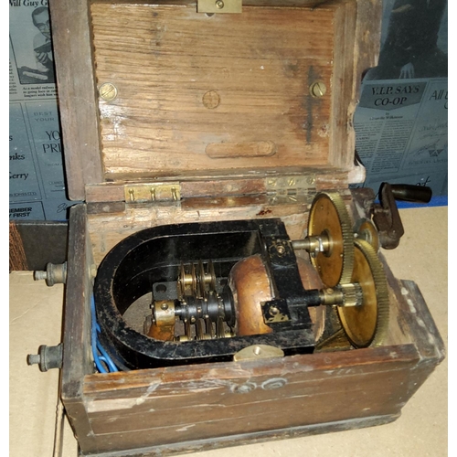 178 - A wooden cased Evershed and Vignoles hand generator