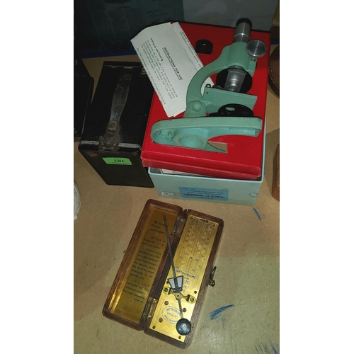 181 - A boxed Britex Pioneer II microscope; a box camera and a wood cased metronome