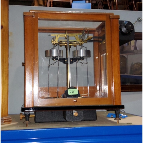 434 - An OERTLING precision laboratory balance in glazed mahogany case
