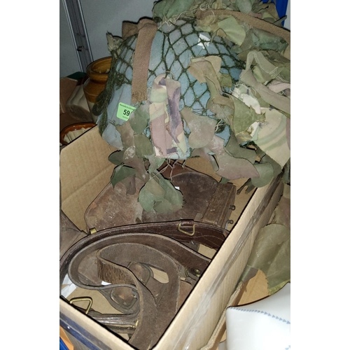 59 - A WWII camouflage tin helmet; leather gaiters; etc.