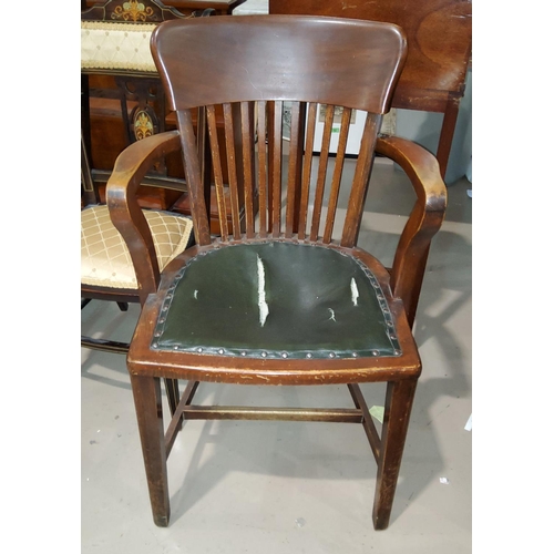 782A - A 1930's desk arm chair with studded seat and stick back