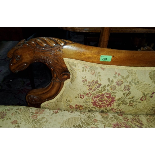 789 - A Victorian walnut chaise longue with scrolled griffin carved back and floral cushions