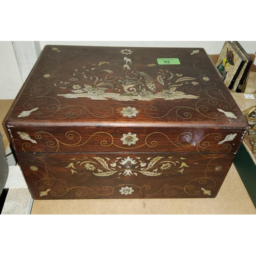 92 - A 19th rose wood jewellery box with mother of pearl 
and brass inlay in the form of a peacock on a p... 