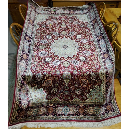 937 - A modern red ground, hand knotted Persian rug, length 184 cm.