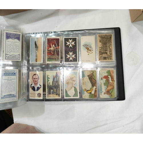 394A - An album of 18 sheets of rarer cigarette cards