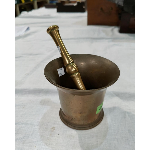 404 - A large 19th century bronze pestle and mortar, 14cm diameter