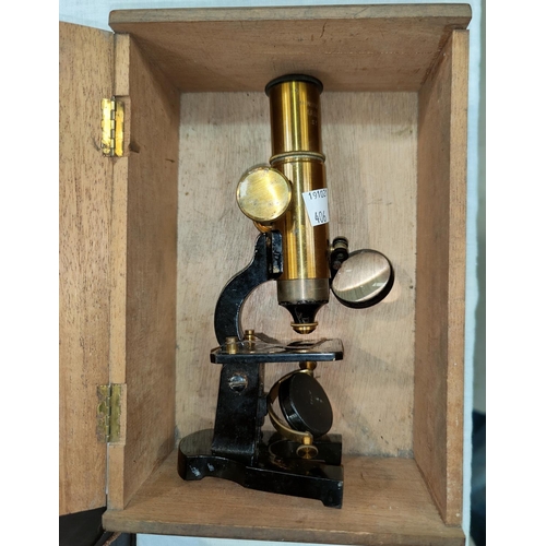 406 - An early 20th century brass microscope by Armes & Cycles 18cm