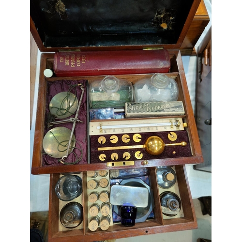 411 - A mahogany medical case containing hydrometer, scales, agate mortar, Pharmacoepia etc, the box with ... 