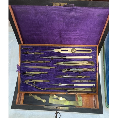 435 - A set of drawing instruments, 19th century, in brass inlaid case with key, 24 x 16cm
