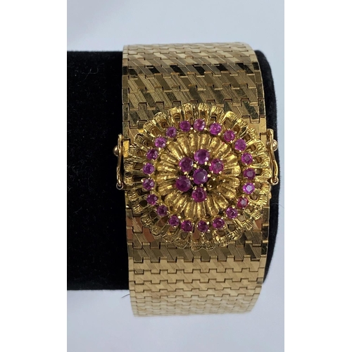 719 - A Continental gold strap bracelet with rose clasp set small rubies, stamped 750, 80.6gm, length 19.5... 