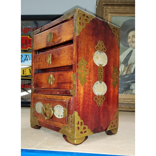 62C - A miniature oriental 4 height chest/jewellery box, with brass and jade coloured mounts.