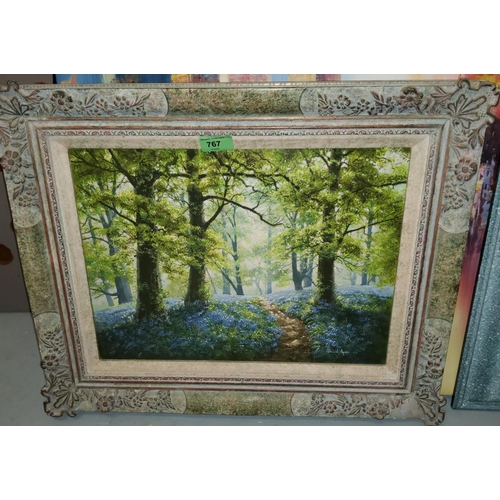 767 - Donald Ayres: modern oil of board of a forrest path with
bluebells, framed 29x39cm