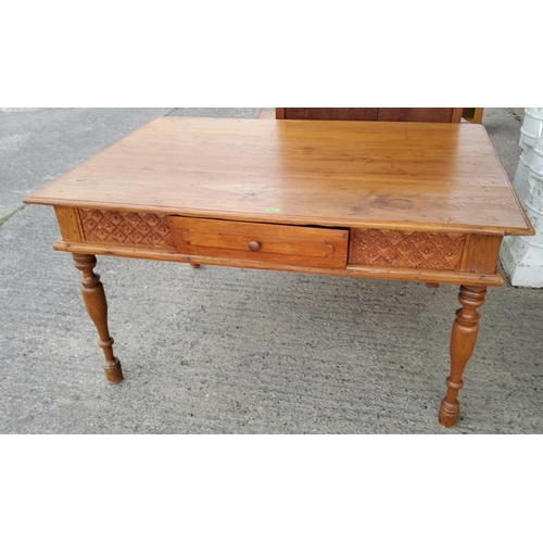 915 - A Victorian style stripped pine kitchen table with tapered legs, carved decoration, single drawer