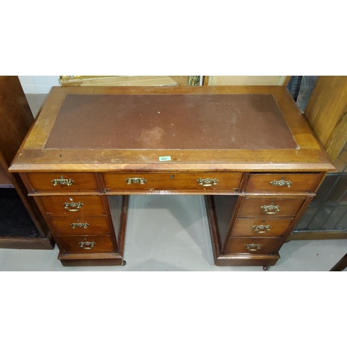 924 - An Edwardian mahogany kneehole desk, inset top, 3 frieze, 6 pedestal drawers with brass handles 105c... 