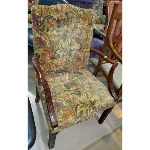 935 - A traditional armchair in floral tapestry, and a similar rectangular stool.