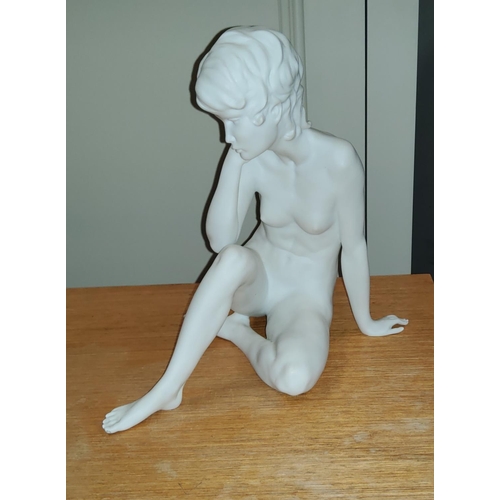 199A - A continental parianware ceramic figure of a resting female nude, Kaiser, W. Germany
