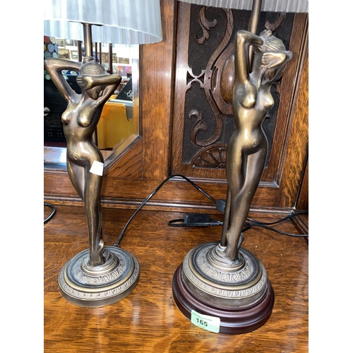 165 - A bronze table lamp in the form of a nude female with folded glass shade