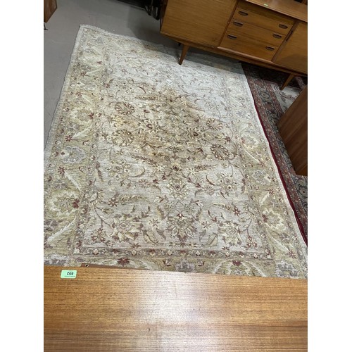 809 - A large hand knotted rug with fawn ground
188 x 274cm