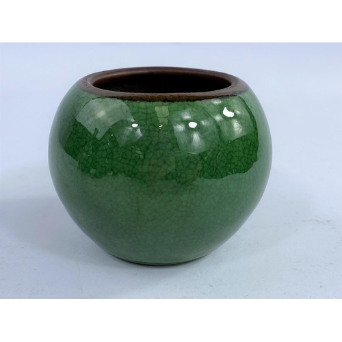 424 - A small globular Chinese monochrome crackle glaze squat globular vase the rim unglazed, height 6.5cm