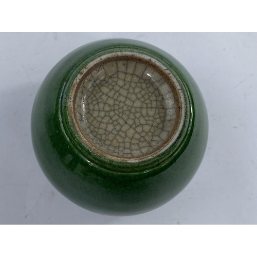 424 - A small globular Chinese monochrome crackle glaze squat globular vase the rim unglazed, height 6.5cm