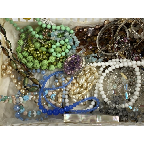 596 - A selection of costume jewellery necklaces including foil beads etc