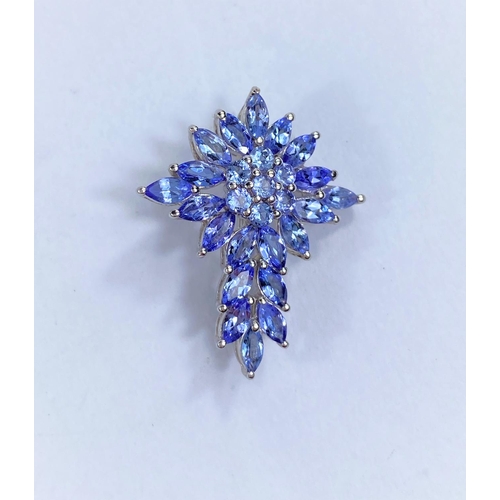 597 - A tanzanite multi stone brooch in the form of a cross stamped '925'