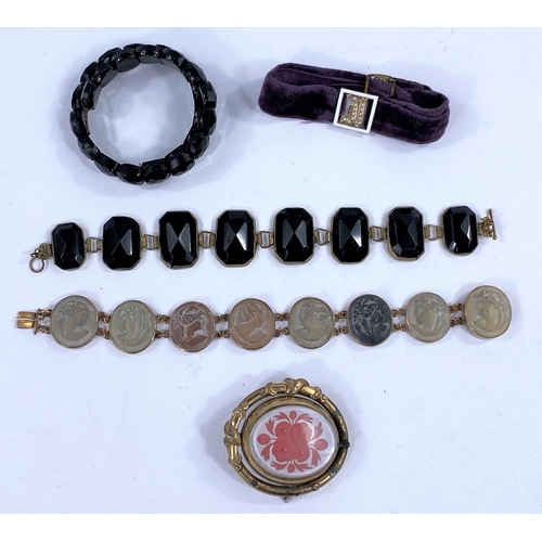 597B - An Italian lava carved cameo bracelet; a jet bracelet; an enamel and seed pearl mounted bracelet etc