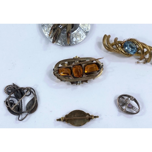 604 - Two art Nouveau style white metal brooches and 3 others