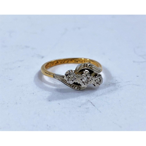 625 - An illusion set diamond crossover ring, stamped '18ct plat', 3 gm
