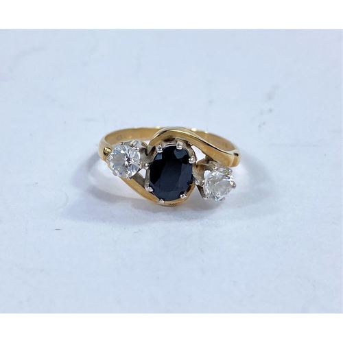 626 - A 9 carat hallmarked gold 3 stone ring with simulated diamond and sapphire in crossover setting, 2.4... 