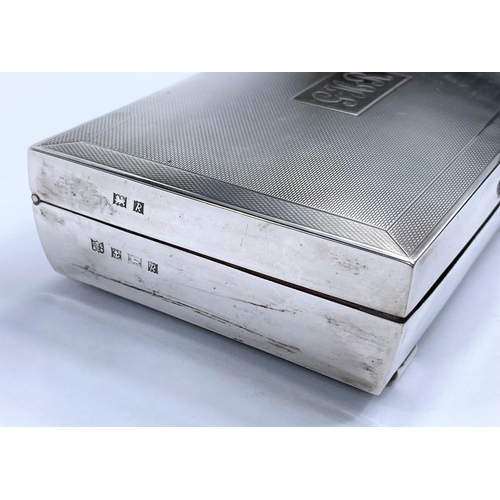 638 - A hallmarked silver rectangular cigarette box, monogrammed, Birmingham 1966