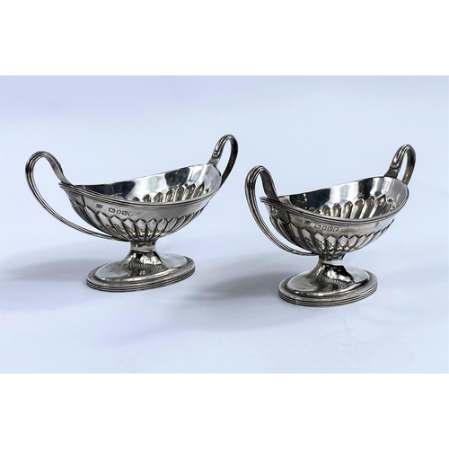 639 - A pair of 2-handled sweetmeat dishes of classical design with fluted lower bodies, on pedestal bases... 