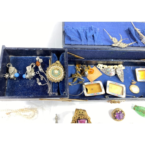 656 - A Victorian leather jewellery box containing coral necklaces; a Cairngorm brooch; a pearl necklace; ... 