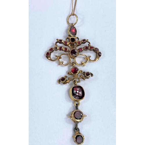 661 - An Edwardian style pendant set garnet coloured stones, on later fine link chain; a pendant set 17 mo... 