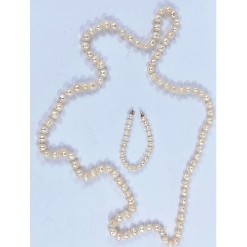 678A - A freshwater pearl necklace and a similar pearl bracelet