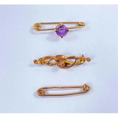 685 - Two 9 carat hallmarked gold bar brooches; another set an amethyst, stamped '9ct', 6 gm