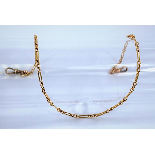 695 - A yellow metal watch chain formed from elongated and triple links, the clip stamped '9', 36.5cm long... 