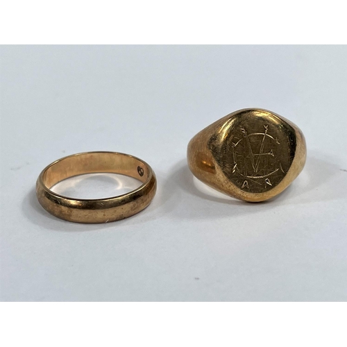 704 - A 9 carat hallmarked gold signet ring, monogrammed; a 9 carat hallmarked gold wedding ring, 10.8 gm