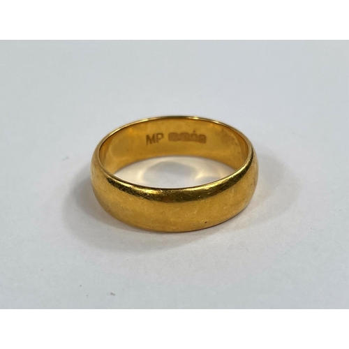 705 - A 22 carat hallmarked gold wedding ring, 6.2 gm