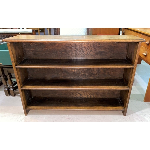 804 - An oak 4 height small bookcase; a walnut occasional table with rectangular top; a long low footstool
