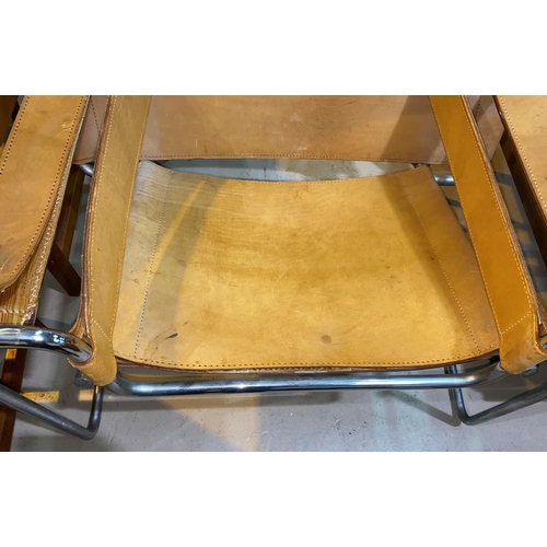814 - A 'designer' armchair in tubular chrome and tan hide