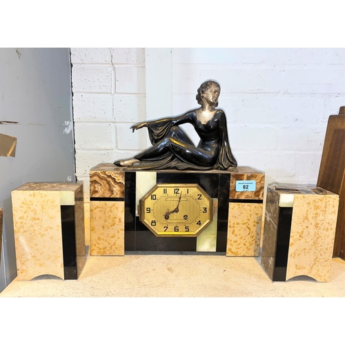 82 - An Art Deco style clock garniture with rectangular clock body made from marble and similar stone, ma... 