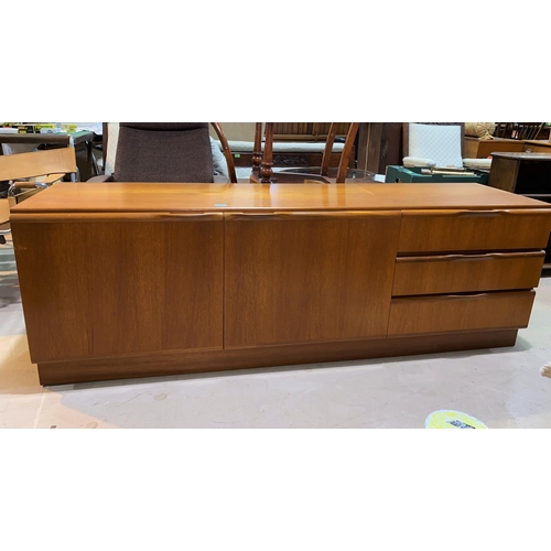 835 - A mid 20th century teak low side unit/sideboard having two cupboards and three drawers, height 60cm,... 