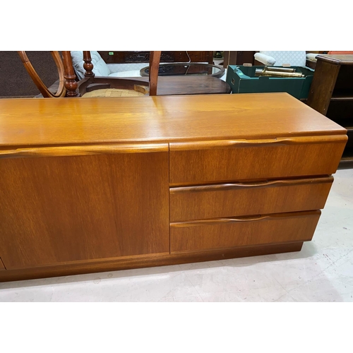835 - A mid 20th century teak low side unit/sideboard having two cupboards and three drawers, height 60cm,... 
