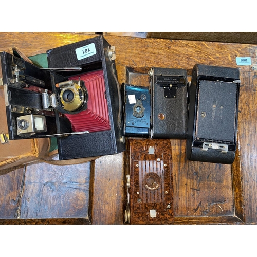 181 - An early KODAK Brownie folding camera and 5 others.